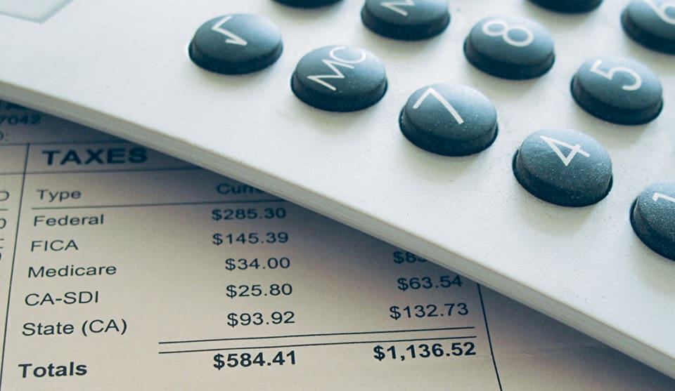 A calculator sitting on top of some paper.