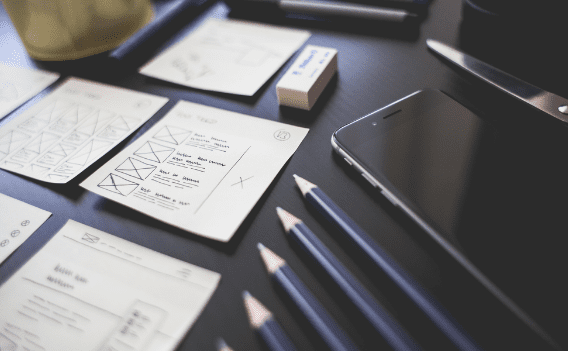 A table with some pencils and papers on it