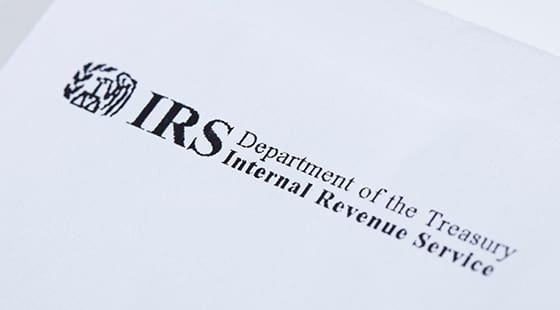 A close up of irs logo on top of the irs document.