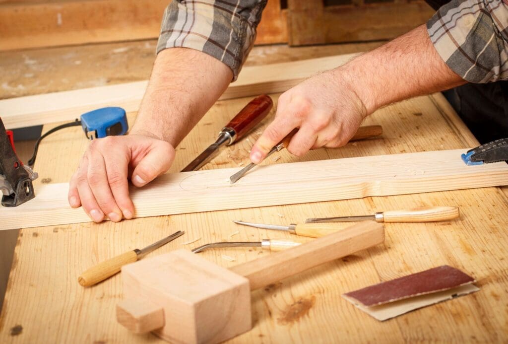 A person using wood to make something