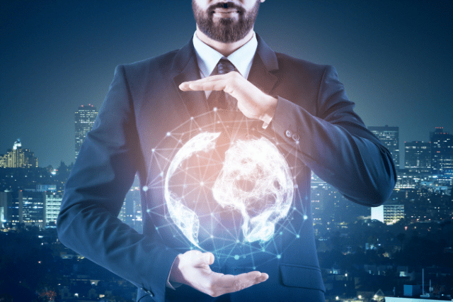A man in a suit holding out his hands