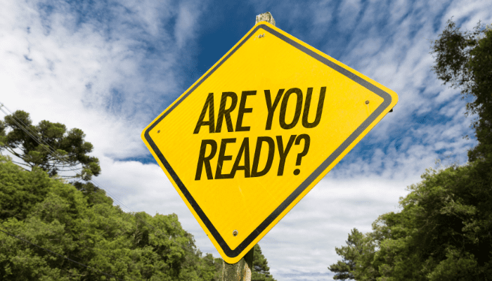 A yellow sign that says are you ready