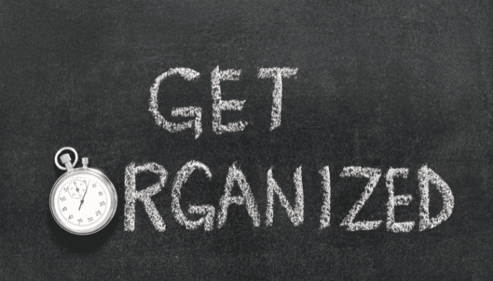 A chalkboard with the words " get organized ".