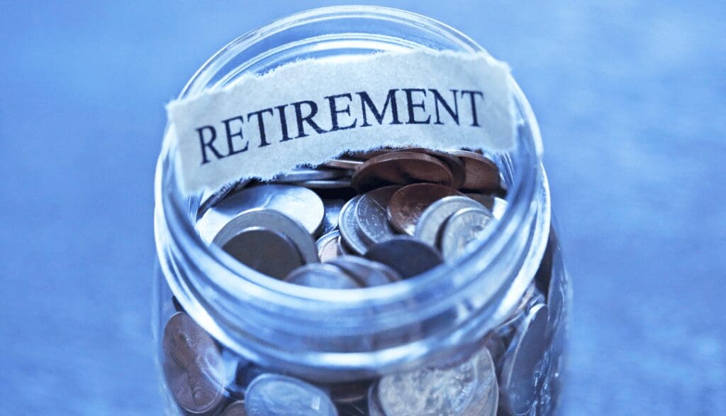 A jar of coins with the word retirement written on it.