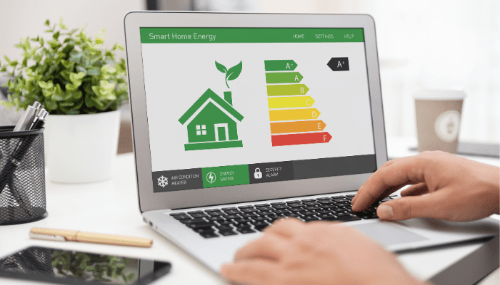 Laptop showing smart home energy efficiency rating.