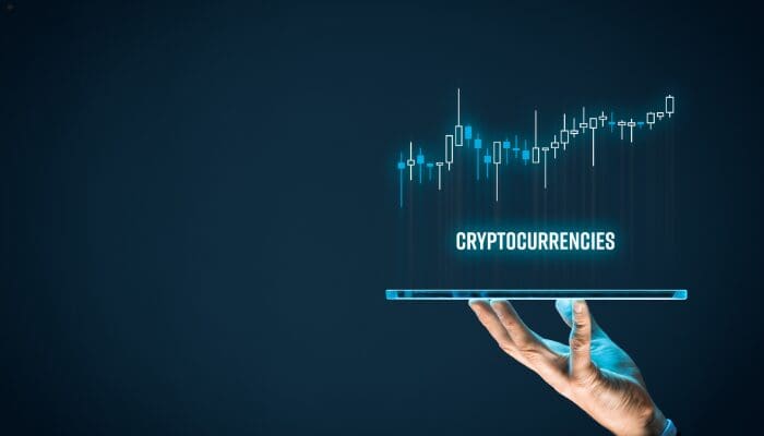 Tablet displaying cryptocurrencies with candlestick chart